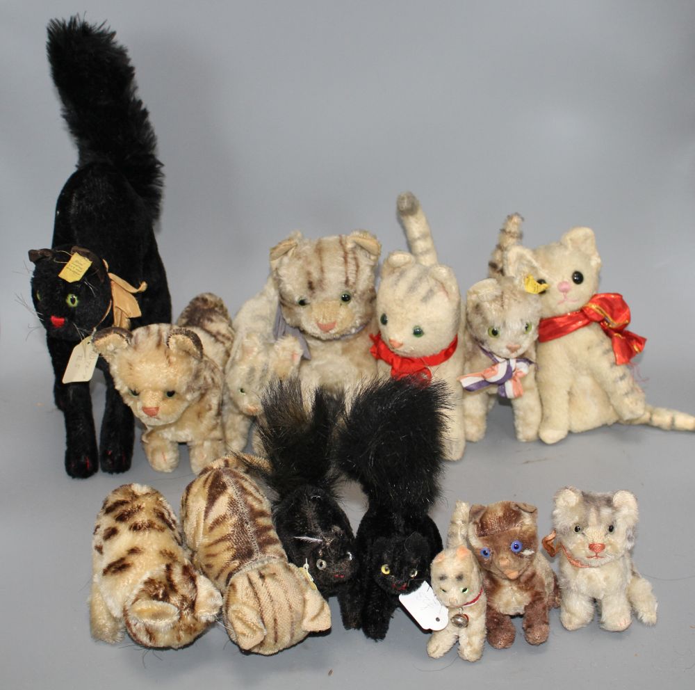 A collection of assorted soft toy cats